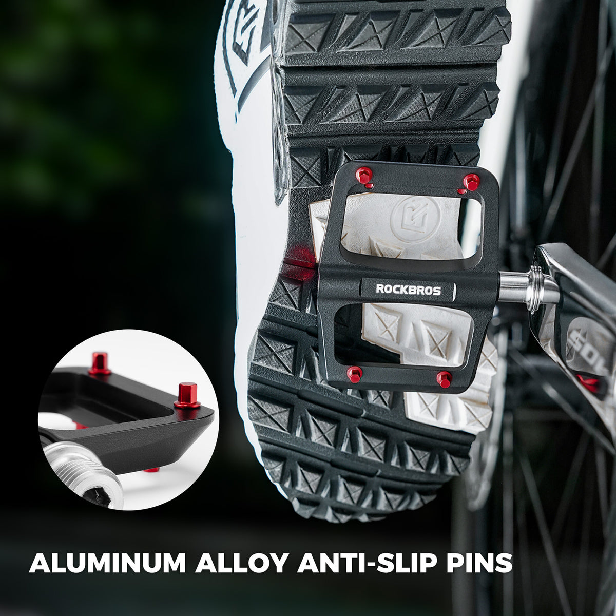 Pair of black ROCKBROS flat pedals with red traction pins and silver axles.